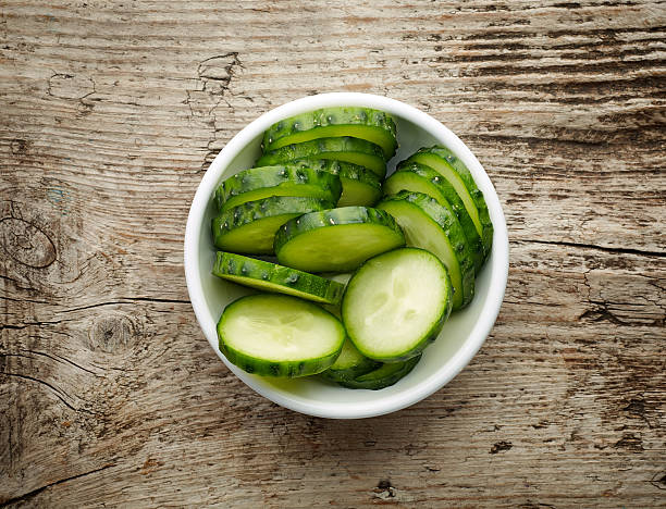 istock Bowl of fresh cucumber slices, from above 614422648