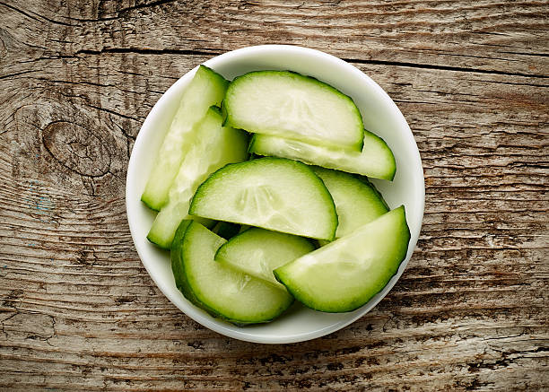 istock Bowl of fresh cucumber slices, from above 614422778