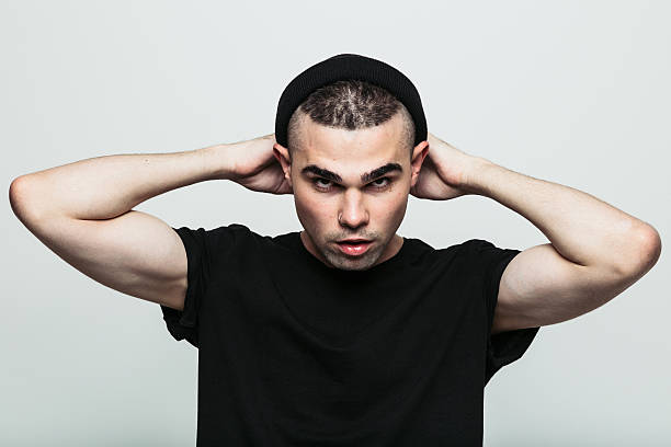 istock Impudent man looking at camera frowningly. 614425118