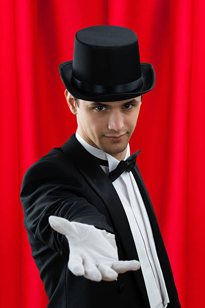 istock Portrait Of Magician Gesturing 614425230