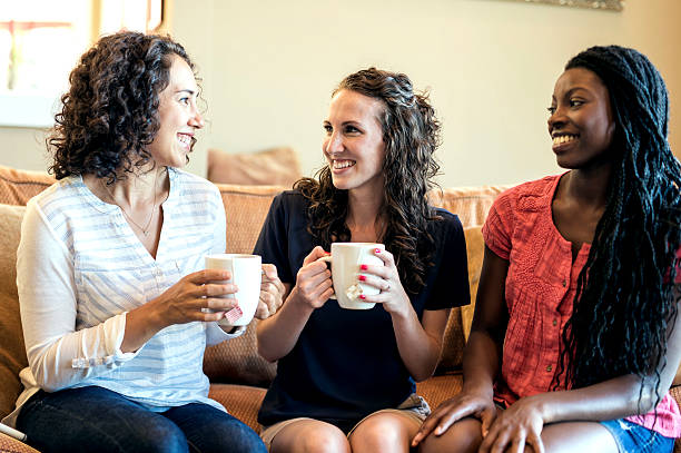 istock Group of diverse friends drinking tea and conversing together 614425528