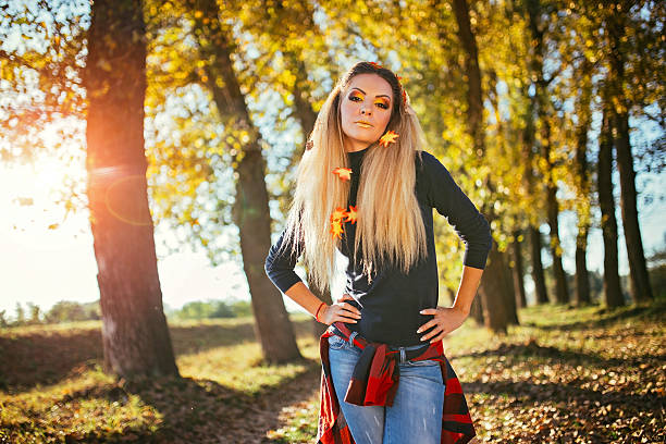 istock Beautiful woman in park 614426112