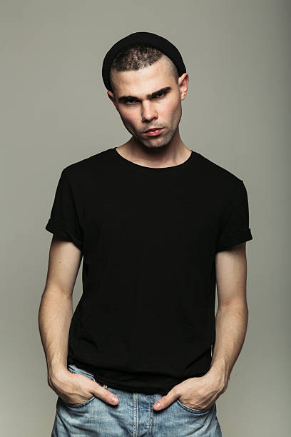 istock Man with short haircut looking into camera 614426254