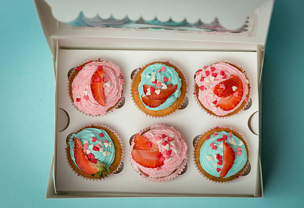 istock View from above on beautiful cupcakes with sprinkles and strawberry 614426640