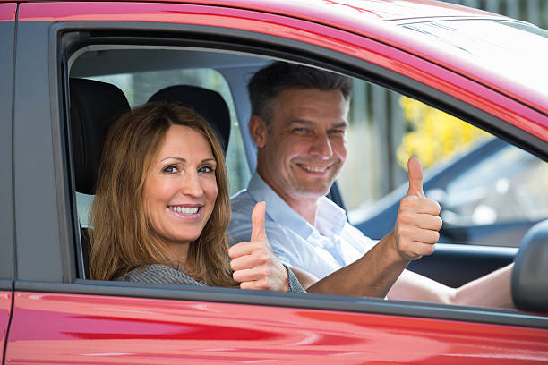 istock Couple Sitting In Car 614427248