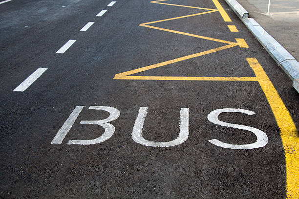 istock Bus lane sign painted on road. 614427534