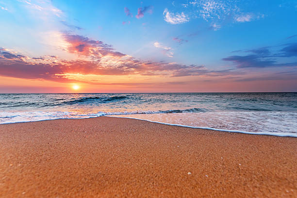 istock Brilliant ocean beach sunrise. 614428140