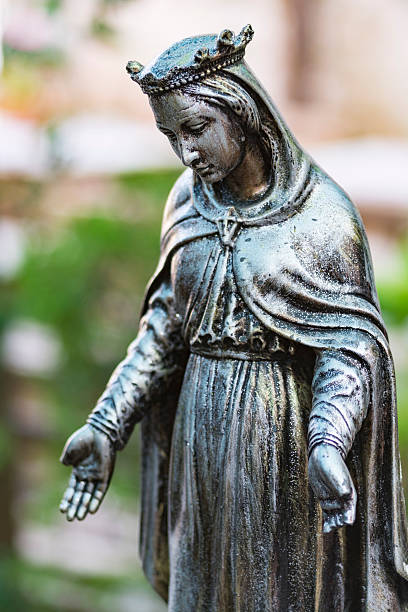 istock Bronze statue of the virgin mary 614428334