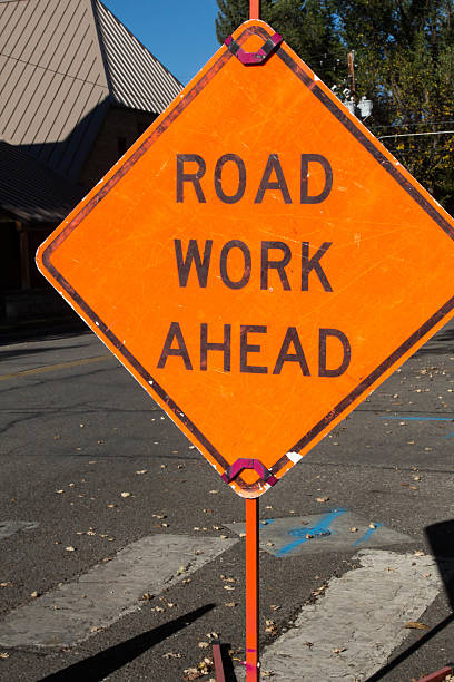 istock Road work ahead sign on a crosswalk 614429244