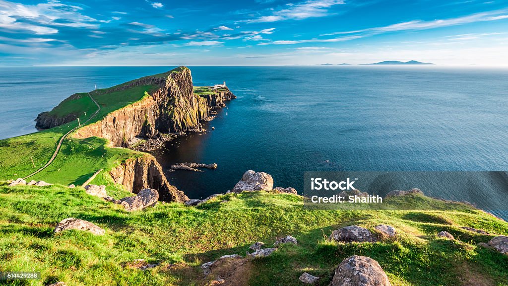 Dusk at the Neist point lighthouse in Isle of Skye Stunning dusk at the Neist point lighthouse in Isle of Skye, Scotland Scotland Stock Photo