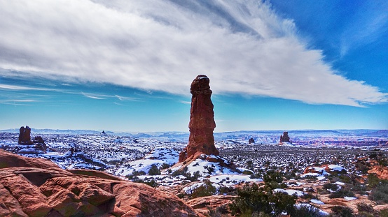Sky, Rock Spire Formations, Arches National Park, Utah. Snow covered ground.