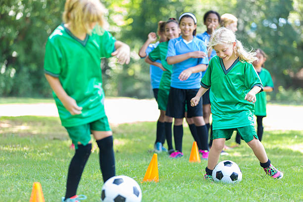 istock Girls soccer teams practice together 614429802