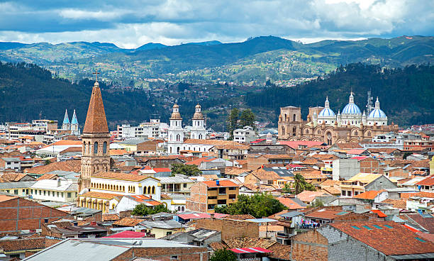 View of the city of Cuenca View of the city of Cuenca, Ecuador, with it's many churches and rooftops, on a cloudy day ecuador photos stock pictures, royalty-free photos & images