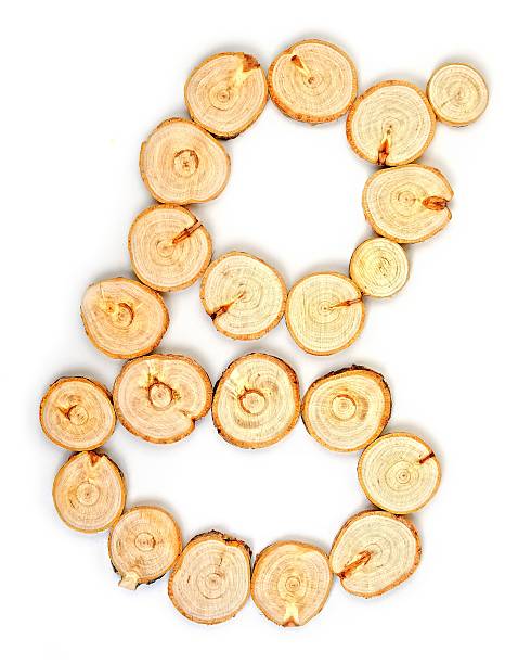 istock Alphabet letters made from Wood slice on white Background.g 614430852