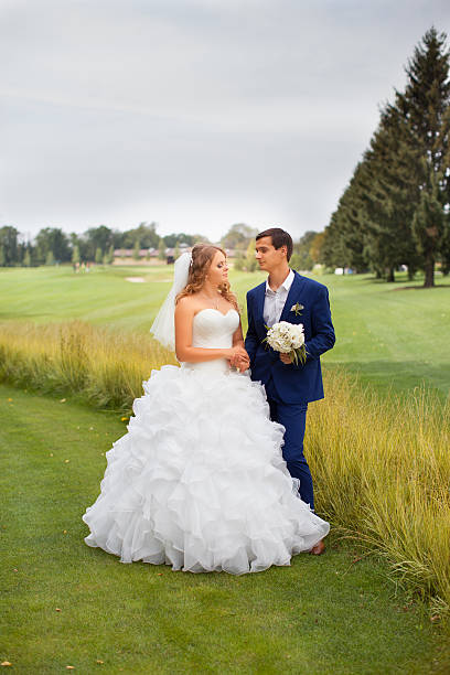 istock Newlyweds on a walk in the countryside 614432184