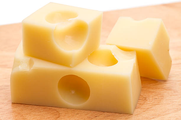 istock Three slices of Swiss cheese 614432548