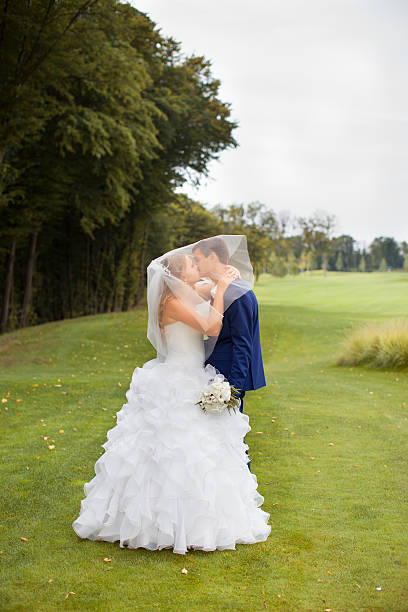 istock Newlyweds on a walk in the countryside 614432560