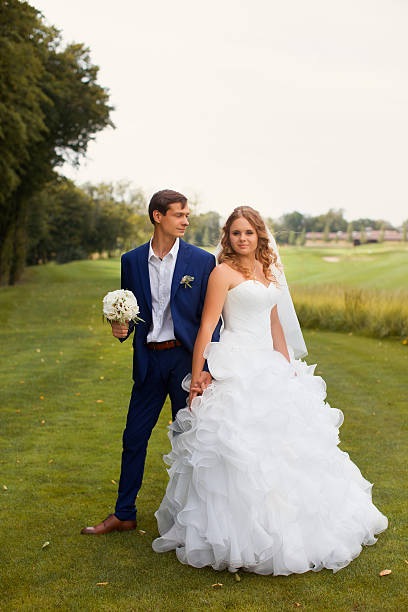 istock Newlyweds on a walk in the countryside 614433526