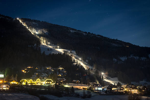 istock illuminated ski slope at Austrian Alps at starry night 614433614