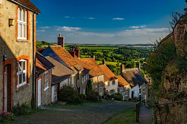 Famous view down Gold Hill, Shaftesbury in the early evening late summer sunshine