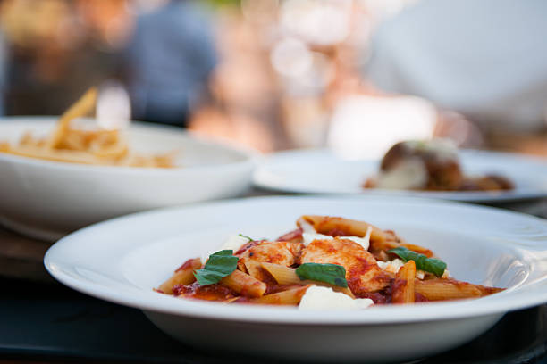 Close-up of tortiglioni pasta with tomato sauce, creating an inviting image of italian cuisine