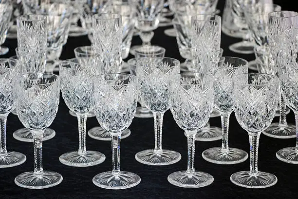 wineglasses on black table 