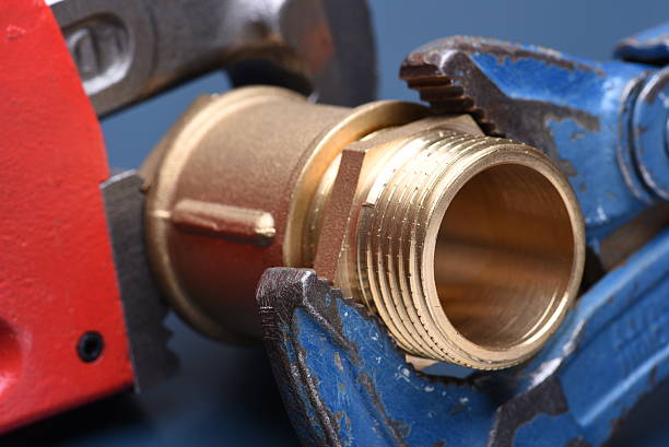 istock Brass fittings and wrench 614435248