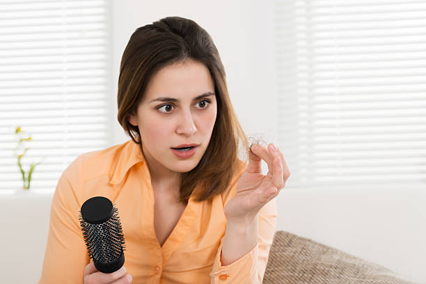 Woman Holding Loss Hair