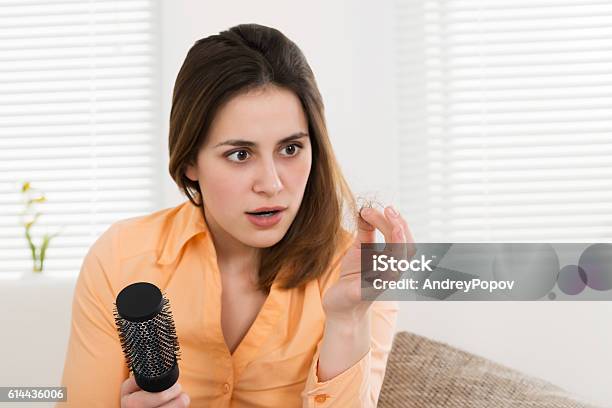 Woman Holding Loss Hair Stock Photo - Download Image Now - Falling, Women, One Woman Only