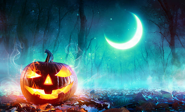 istock Fiery Pumpkin In A Haunted Forest In The Moonlight 614436752
