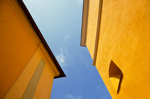 Geometric yellow structure details and blue sky background in Chesky Krumlov