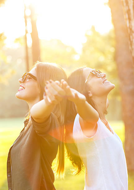 istock Two beautiful young woman expressing freedom 614439254