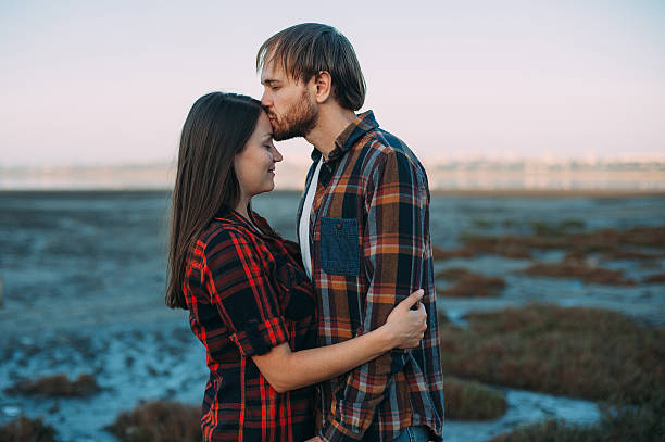 istock Young couple kissing and hugging 614439754