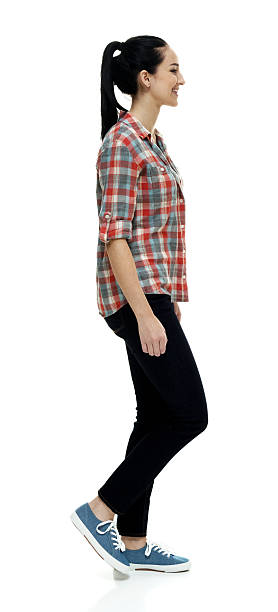 istock Smiling female walking 614440768
