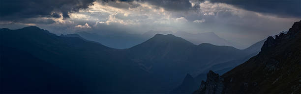 istock Silhouettes of ridges at sunset. Greater Caucasus Mountain Range 614440866