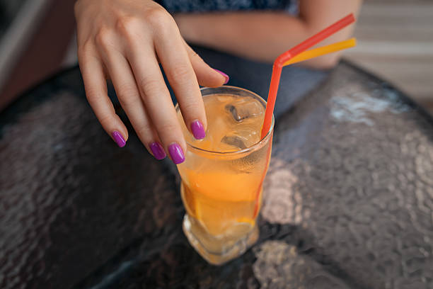istock female has lunch with cold lemonade cocktail, 614440984