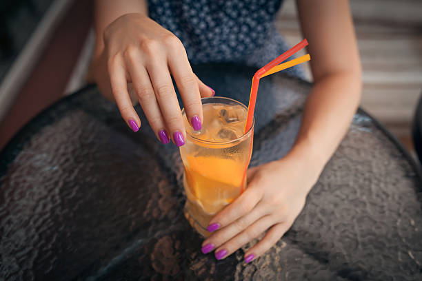 istock female has lunch with cold lemonade cocktail, 614441916