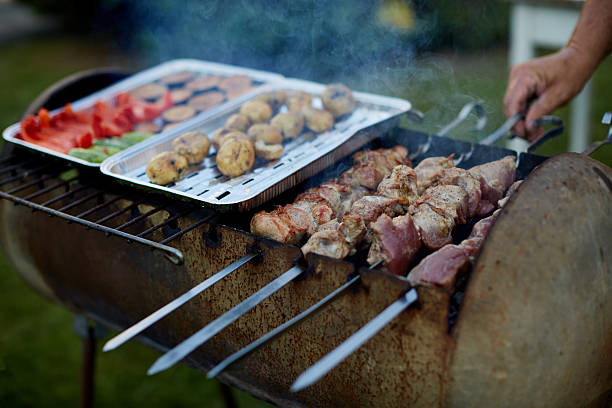 istock Assorted delicious grilled meat with vegetable on a barbecue grill. 614442100