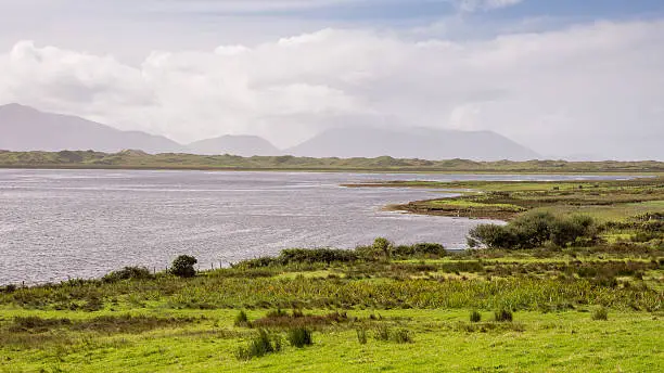 The stand dune system at Inch Strand stretches out into Dingle Bay, with the mountains of the Iveragh Peninsula behind, in Ireland's County Kerry.