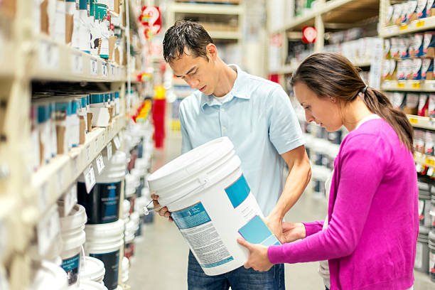 istock Heterosexual couple choosing a paint type 614443830