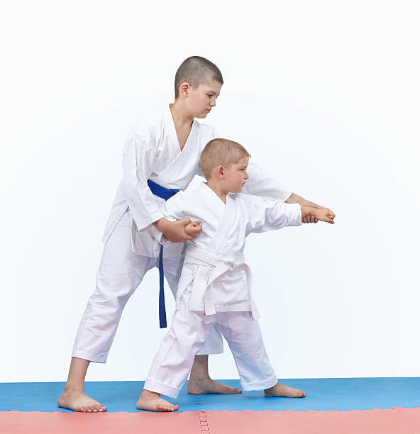 istock Brother is teaching brother beat punch arm 614444656