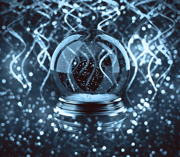 istock magic glass Christmas ball with ribbon bokeh 614445996