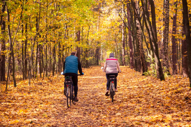 istock couple in autumn park 614446024