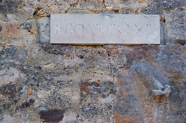 istock Phallic Stone Marker on a Building in Pompeii, Italy 614446278