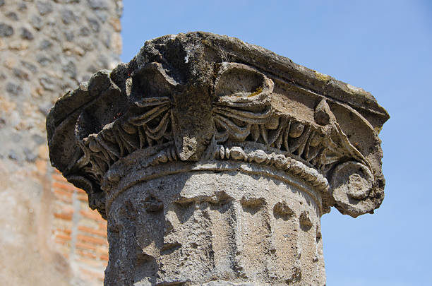 The capital portion of a Corinthian column created in Pompeii over 2,000 years ago is still in relatively good condition.  The city, located near present day Naples, Italy, was first founded in the 7th century BC and became a cosmopolitan port city, reaching a population of over 11,000.  In 79 AD nearby Mount Vesuvius erupted violently, catching many citizens unaware, and depositing over 20 feet of ash and pumice across the region.  People were frozen in time, encapsulated by the ash and preserved for 1,500 years until portions of the city were excavated.  Plaster was used to fill the voids where human beings had been trapped, giving present day visitors a detailed example of what life was like on the day of the eruption.  Preserved were a remarkable water system (aquaducts), an amphitheater, forum and theater, villas with colorful fresco paintings, public baths, temples, and various businesses.