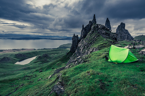 Dramatic clouds over campsite in Old Man of Storr in Scotland