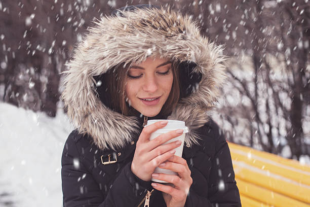 istock Woman drinking hot beverage 614447208