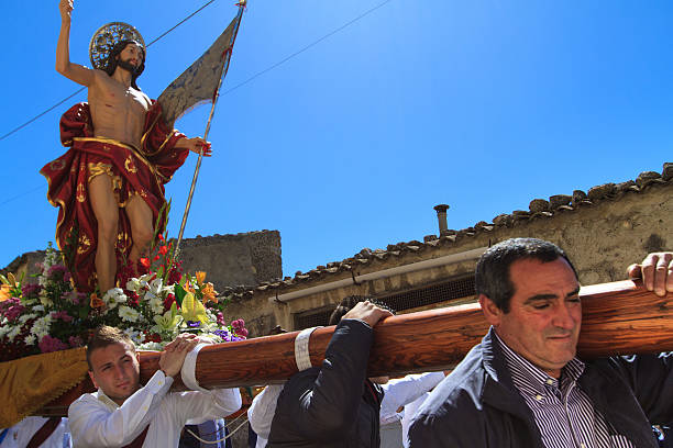 Ferla, Sicily, Italy - March 31, 2013: Men carrying a statue of Jesus on their shoulders on Easter Day in Ferla, a village in Siracusa Province.