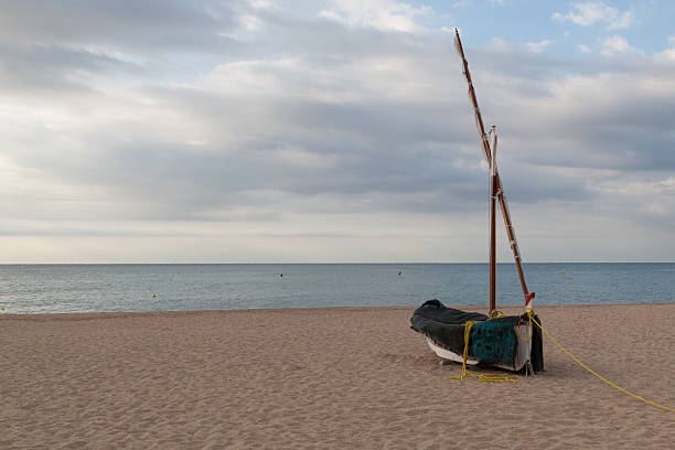 istock Fishing boat on the beach 614449050