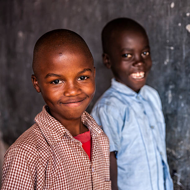 istock African young boys are learning English language, orphanage in Kenya 614491112